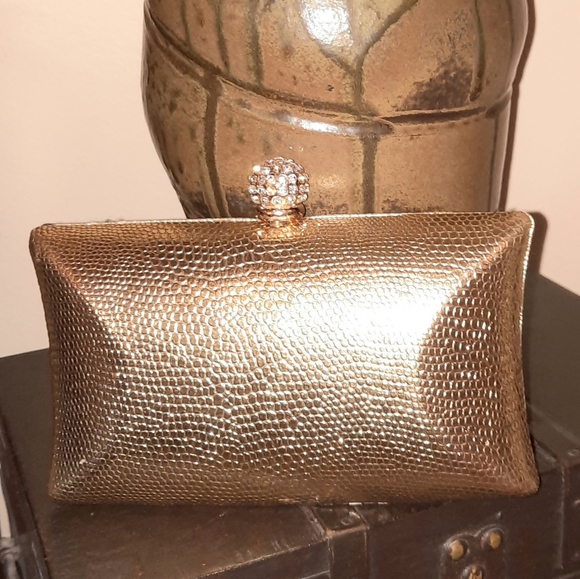 bebe Handbags - BEBE Gold Mini Clutch